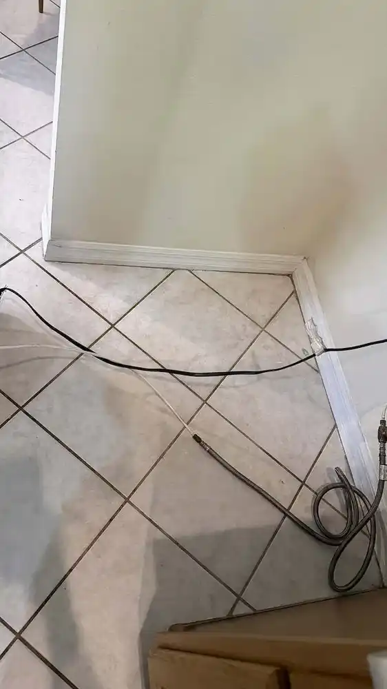 Cleaning under the refrigerator after cleaning