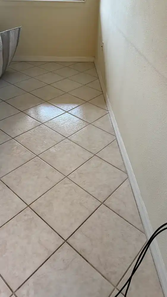 Cleaning beneath the sofa after cleaning