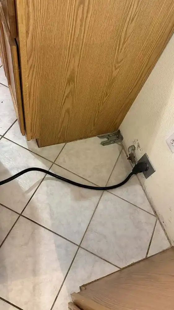 Cleaning under the stove after cleaning