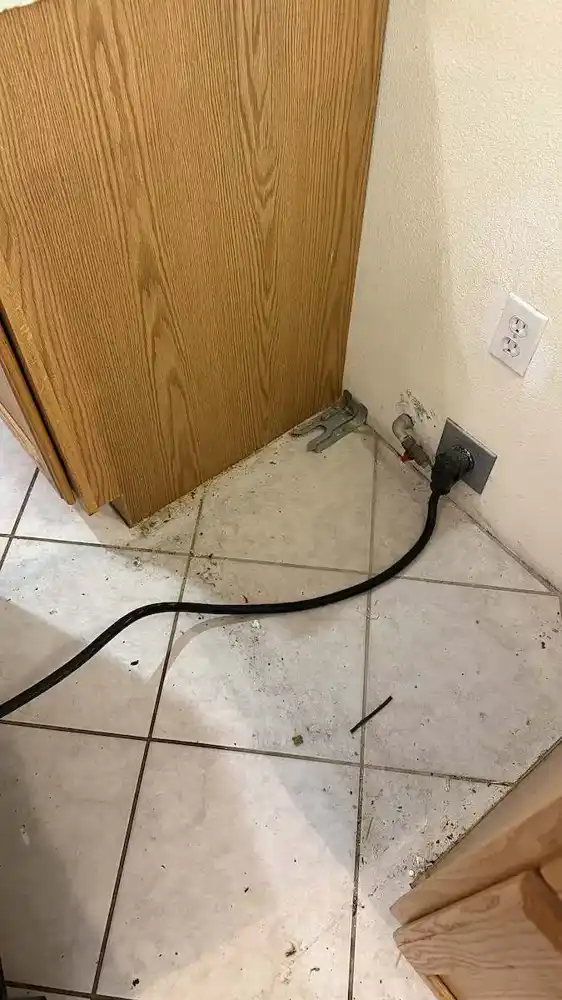 Cleaning under the stove before cleaning